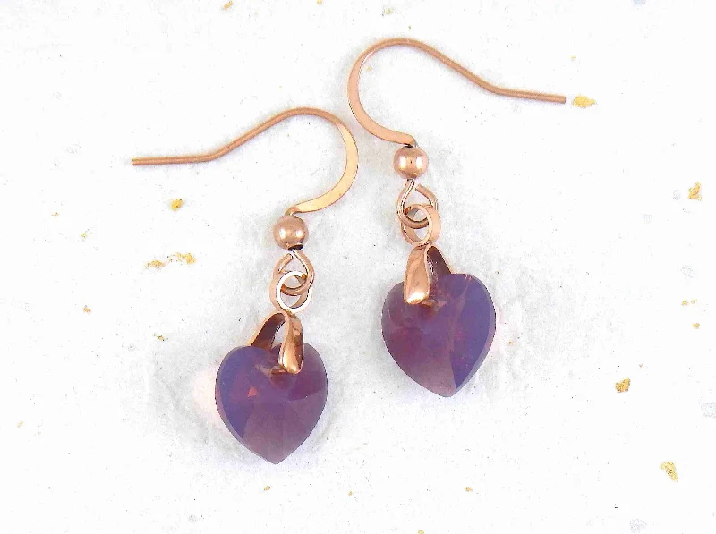 Short earrings with 10mm faceted Lilac Shadow Swarovski crystal hearts, rose-gold toned stainless steel hooks