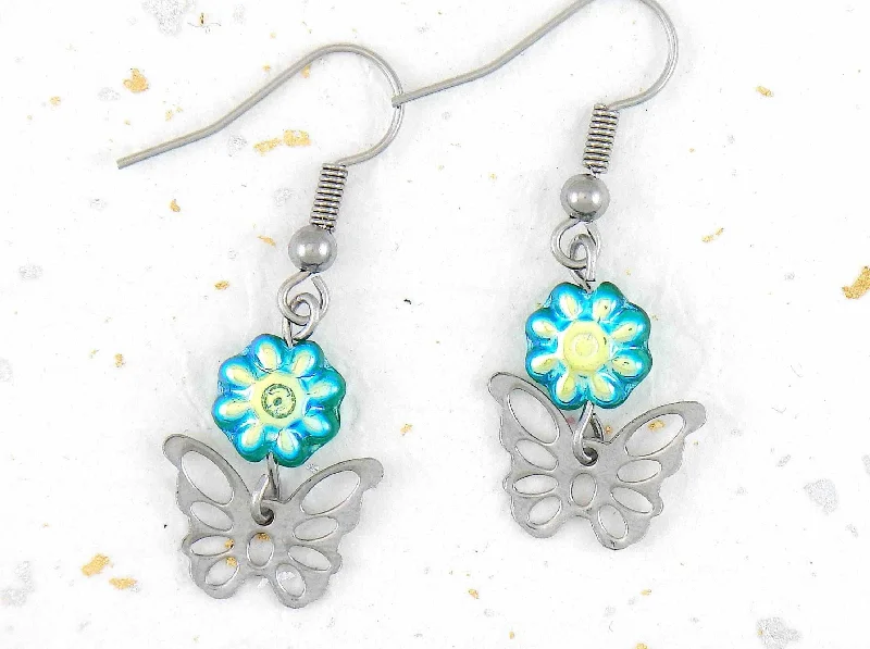 Short earrings with stainless steel butterflies and iridescent green Czech glass flowers, stainless steel hooks