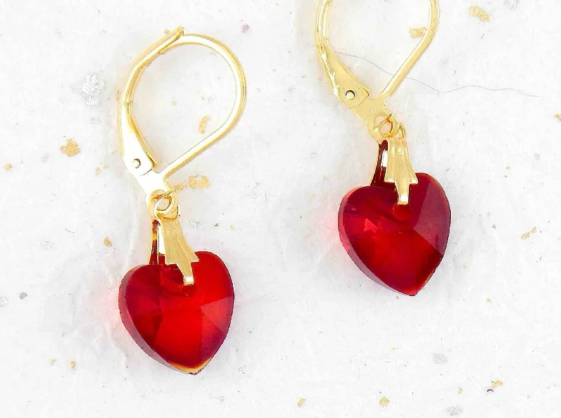 Short earrings with 10mm faceted Siam (deep red) Swarovski crystal hearts, gold-toned stainless steel lever back hooks