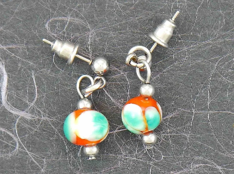 Short earrings with burnt orange glass balls, white and green dots (Murano-style glass handmade in Montreal), stainless steel posts