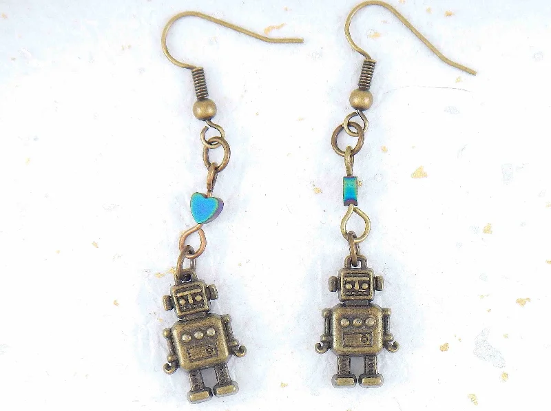 Long earrings with small brass robots and iridescent hematite hearts, brass hooks