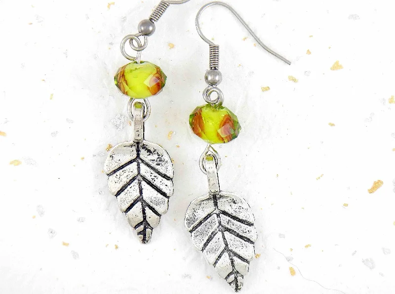 Long earrings with pewter leaves and lime green faceted crystal balls, tiny rose detail, stainless steel hooks