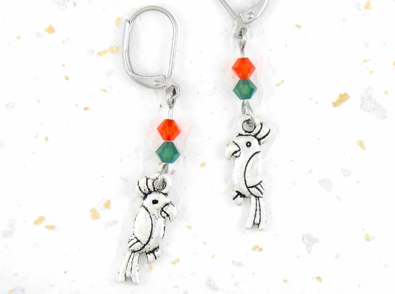 Long earrings with small pewter cockatoos (parrots) and Swarovski crystals, stainless steel lever back hooks