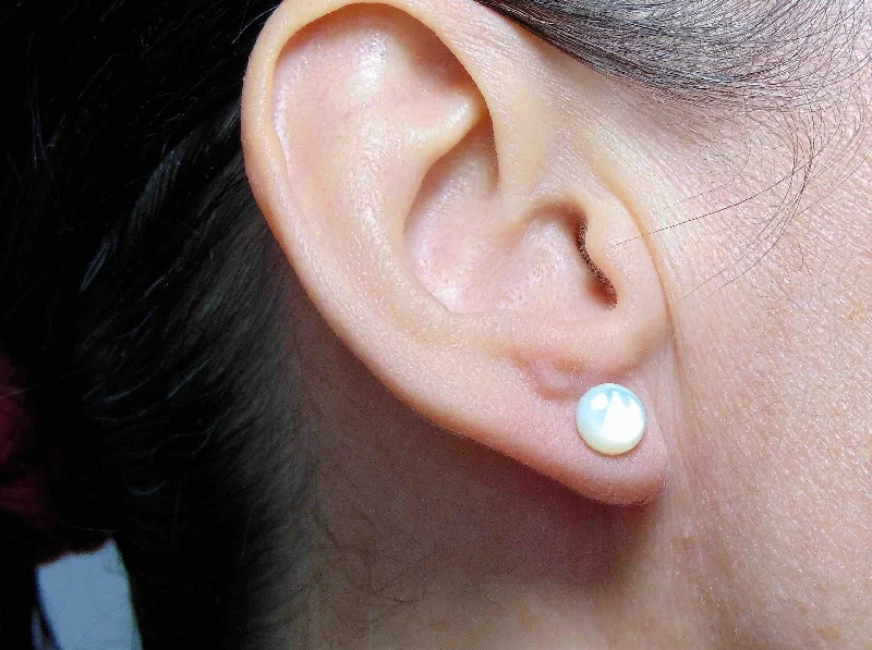 Ear studs with 8mm round iridescent white mother of pearl cabochons, stainless steel posts