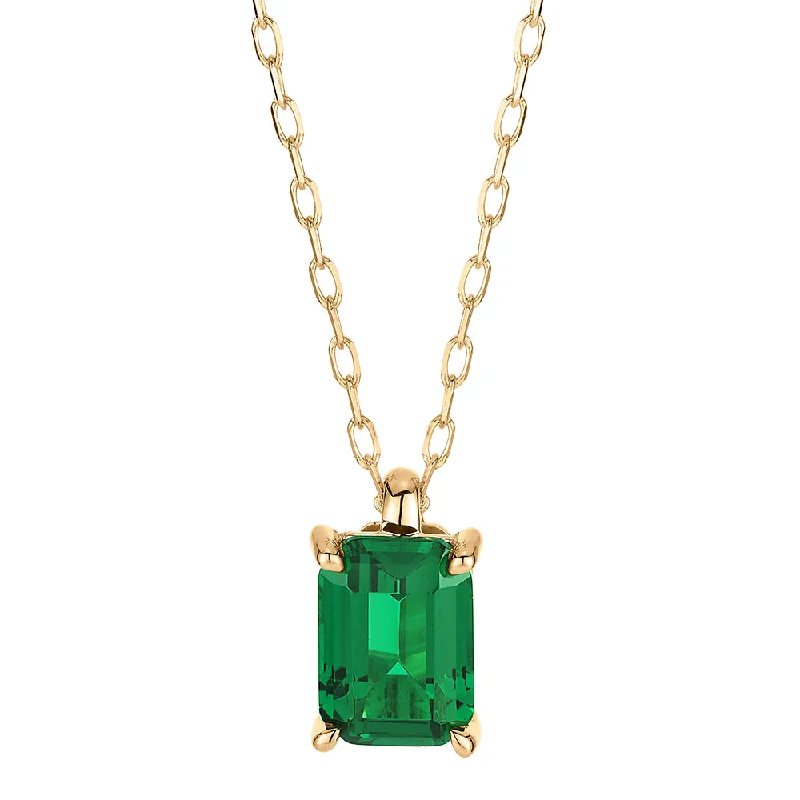 Old medallion necklaces-Emerald Cut solitaire pendant with emerald simulant in 10 carat yellow gold