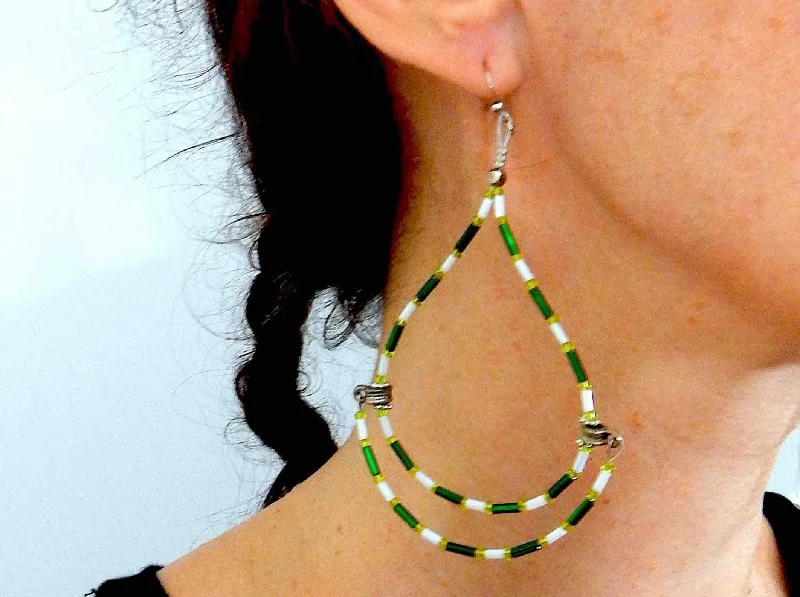 Long statement earrings with original hoop design in white and green, metal hooks