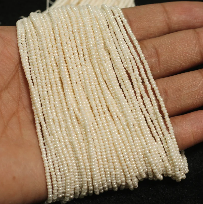 Flow shape rings-10 Strings, 11`0 Preciosa Seed Beads Off White