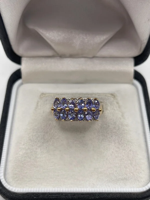 Light filigree rings-9ct gold tanzanite and diamond ring