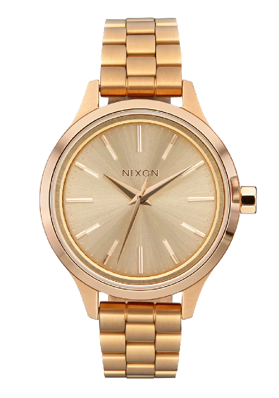 Rustic style watches-Nixon Optimist Stainless Steel Gold Dial Womens Watch A1342-5087-00